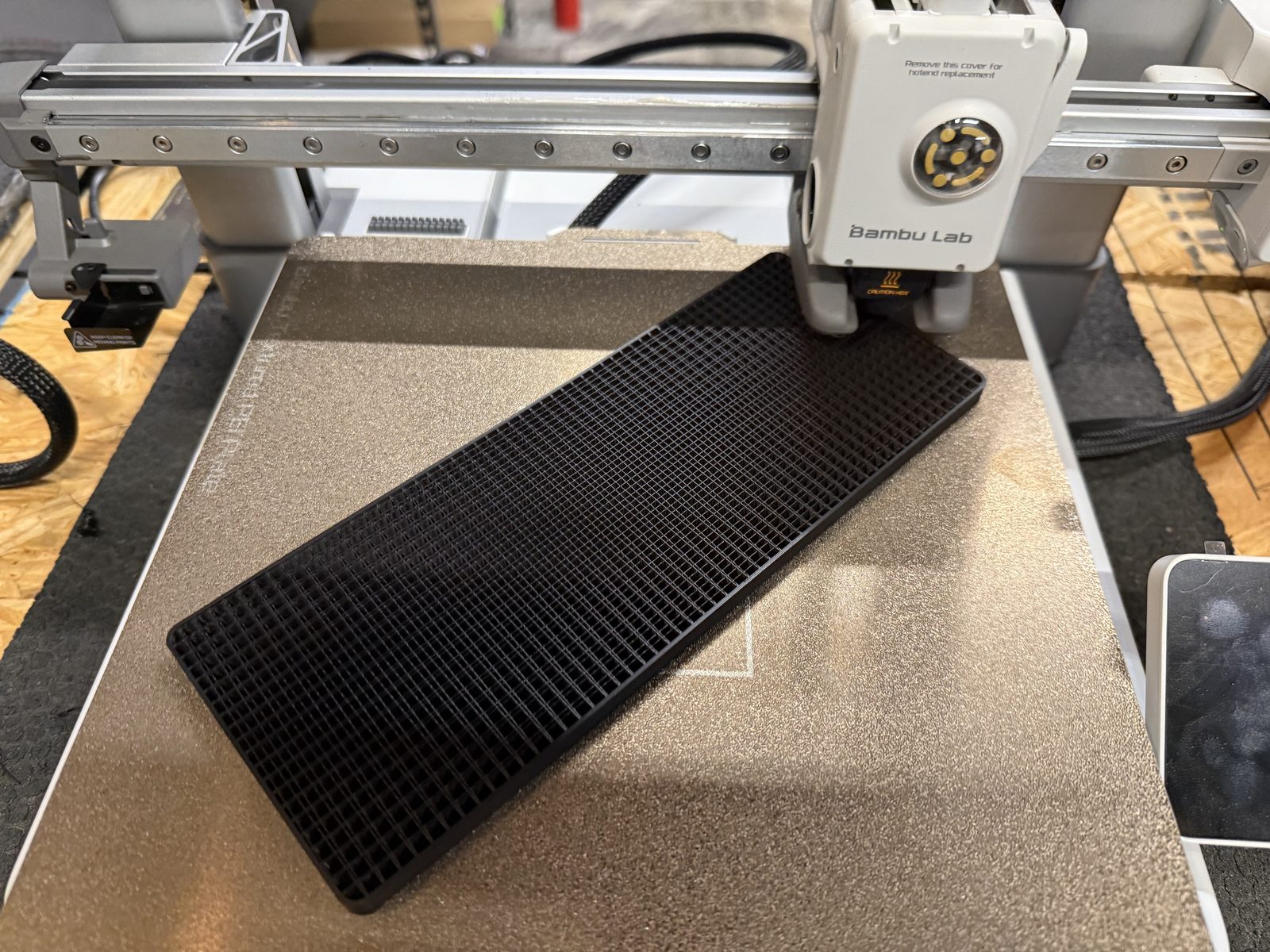Bambu Lab 3D printer producing a part at Lilland Precision